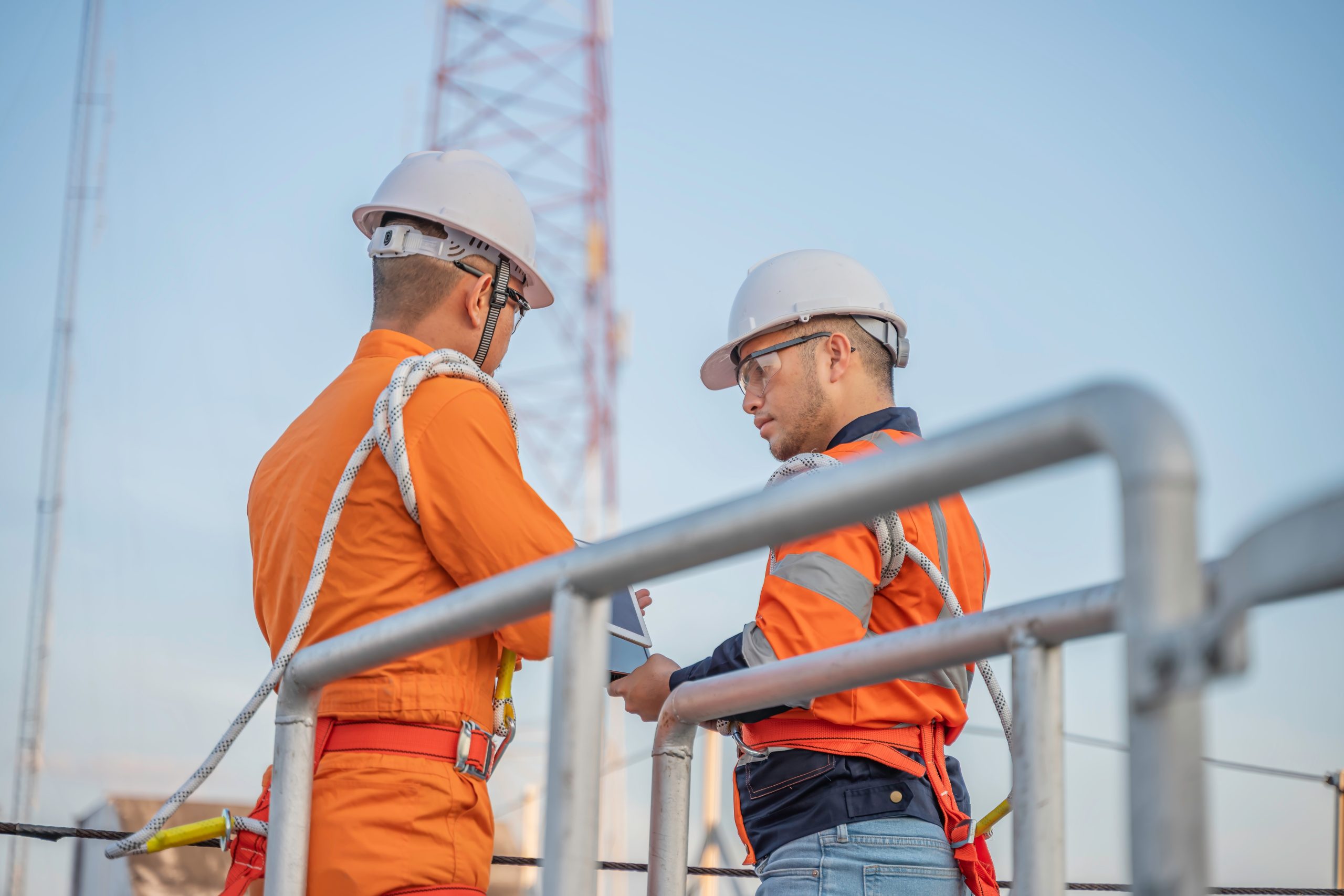 Telecommunication,Engineers,Working,On,5g,Tower,technicians,Climbing,High,Telecom,Poles,ensuring